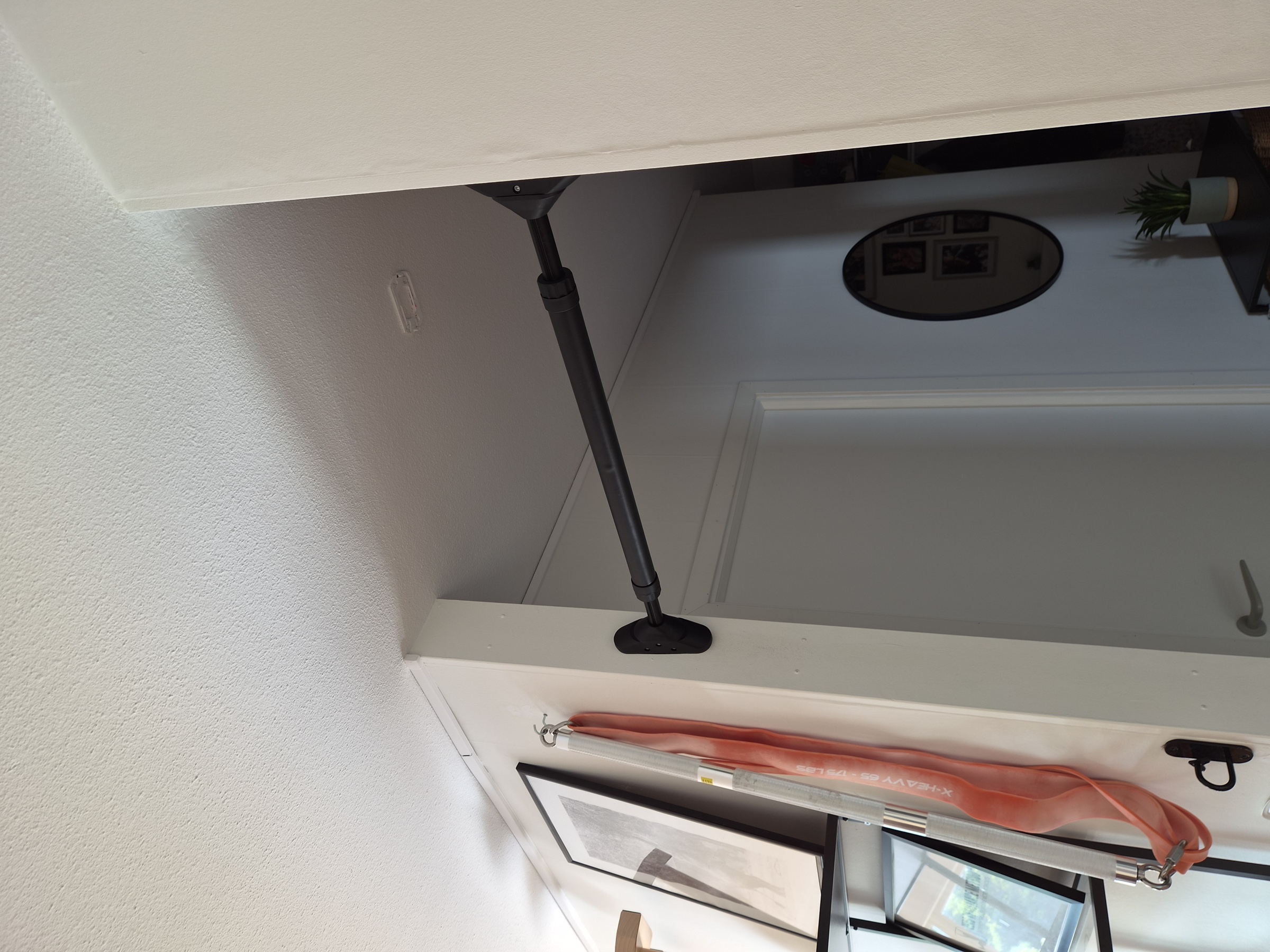 The pull-up bar in the living room doorway